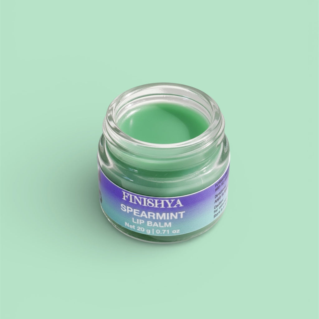 An open jar of green Spearmint Lip Balm by Finishya, showing the smooth texture of this cruelty-free NZ skincare product.