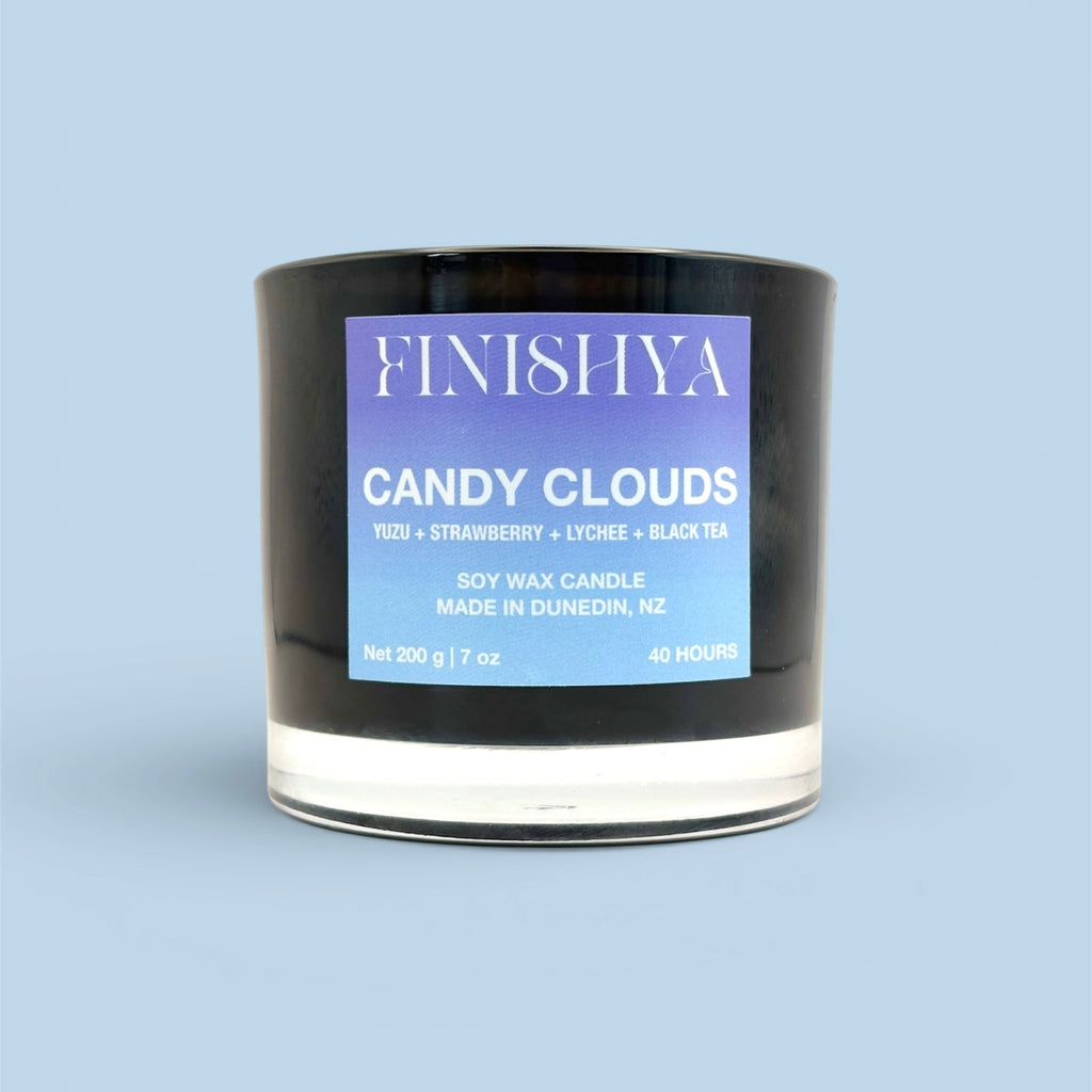 Front view of Finishya Candy Clouds scented candle label. Vegan-friendly and cruelty-free soy wax candle, 200g with a 40-hour burn time.