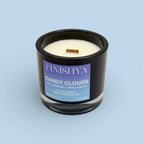 Finishya Candy Clouds soy wax candle in a black glass jar with a wood wick, featuring notes of yuzu, strawberry, lychee, and black tea. Hand-poured in Dunedin, New Zealand.