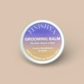 A 30g tin of Finishya Grooming Balm in Lemon, Sandalwood, and Amber scent with a gold gradient label.