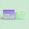 Finishya Jasmine Hand and Body soap bar next to its purple and lilac packaging, highlighting the 120g weight and Dunedin origin.