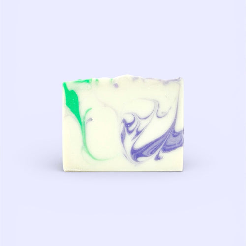 A single bar of Finishya Lavender Hand and Body soap with artisanal purple and green marbling against a soft lavender background.