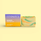Finishya Mango hand and body soap bar next to its purple and orange sunset-themed box, labeled "Made in Dunedin, NZ."