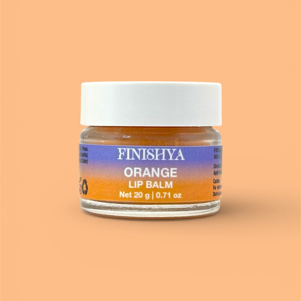 Finishya Orange Lip Balm 20g jar against a vibrant orange background. Vegan and cruelty-free lip care for sensitive skin.