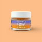 Finishya Orange Lip Balm 20g jar against a vibrant orange background. Vegan and cruelty-free lip care for sensitive skin.