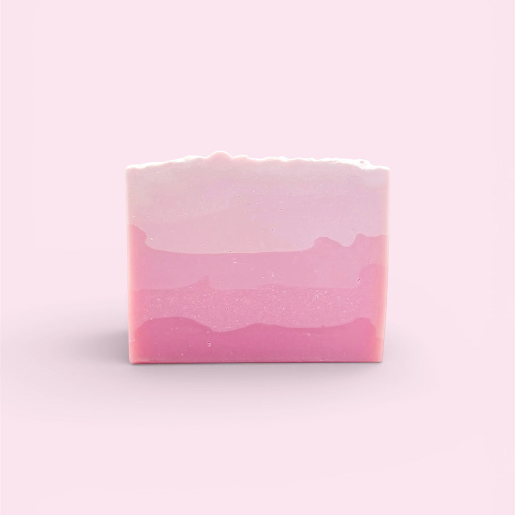 A single bar of Finishya Rose soap featuring a five-tiered pink ombre gradient design against a soft pink background.
