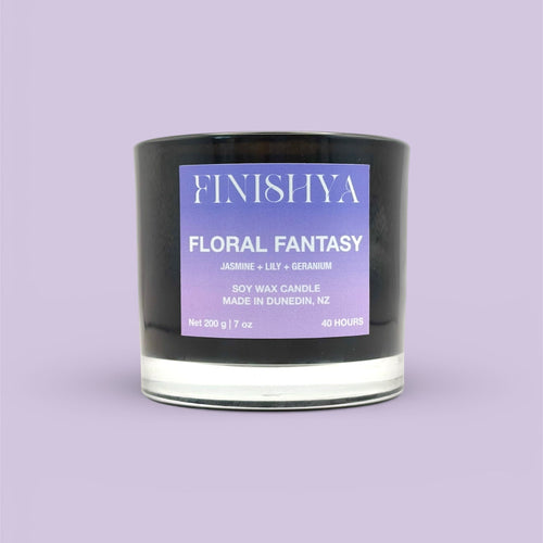Front view of Finishya Floral Fantasy 200g soy candle in a premium black glass jar with a purple gradient label.