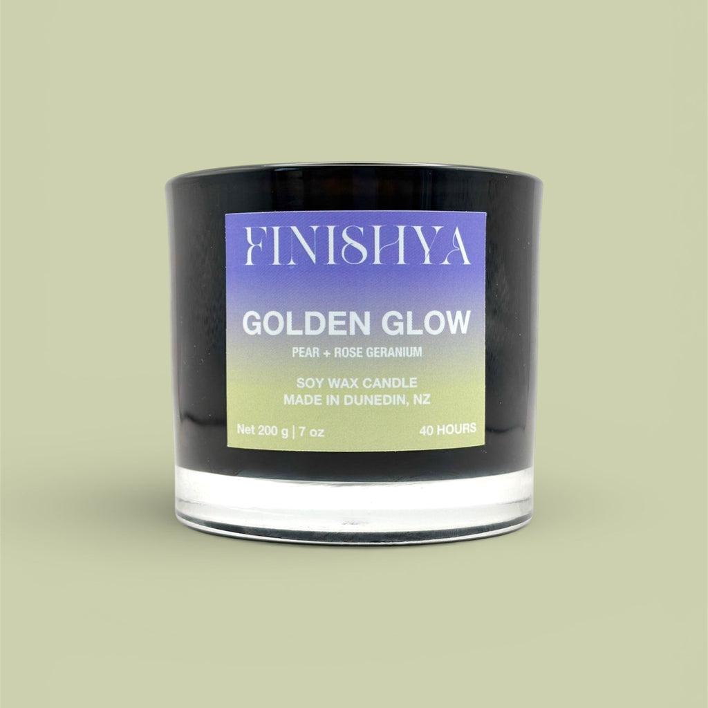 Front view of Finishya Golden Glow 200g soy wax candle featuring a purple and lime green gradient label, 40-hour burn time.