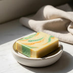 Close-up of Finishya Mango soap bar with water droplets on the surface, highlighting its smooth texture and vegan ingredients.