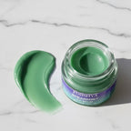 A smooth green texture swatch of Finishya Spearmint Lip Balm on a marble surface, showcasing its creamy consistency.