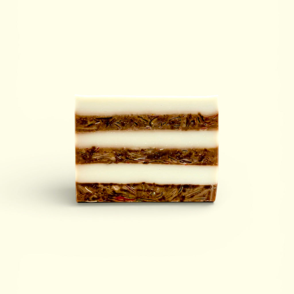 A single bar of Finishya Vanilla hand and body soap featuring distinct white and brown textured layers against a soft cream background.