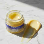 A rich texture swatch of Finishya Vanilla Lip Balm next to the jar, showcasing the smooth consistency of this NZ-made lip treatment.
