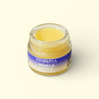 Open glass jar of Finishya Vanilla Lip Balm showing the smooth, creamy yellow texture suitable for sensitive lips.